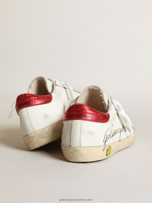 lapsed noored superstaari tossud jäähalli seemisnahast tähe ja punase metallist nahast kontsagaGolden Goose B6B0T869