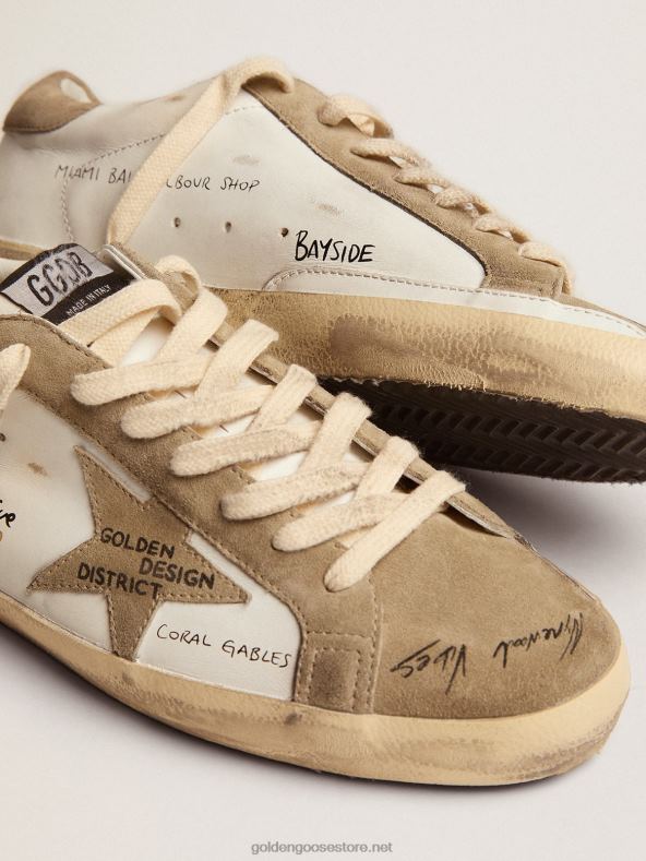 mehed valgest nahast superstaar-tossud tuvihallide seemisnahast vahetükkide ja üleni musta kirjagaGolden Goose B6B0T511