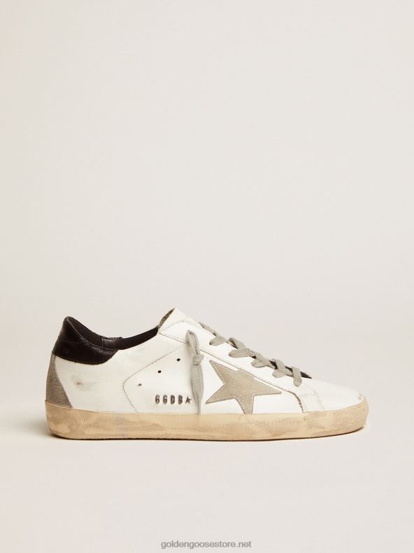 naised super-staar tossud musta kontsa sakiga ja metallist naastudegaGolden Goose B6B0T10